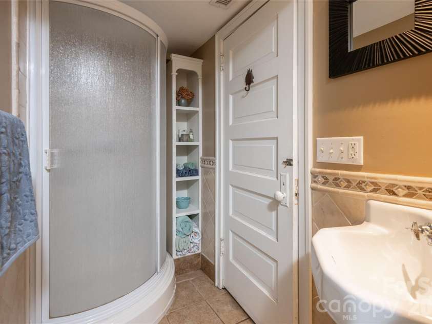 334 Vanderbilt Road, Biltmore Forest, NC 28803.  MLS# CAR4389681, YatesRealty ID 32247. Lower Level Bathroom