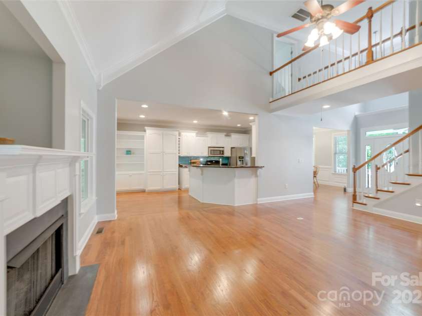 6414 Winding Creek Lane, Denver, NC 28037.  MLS# CAR4240521, YatesRealty ID 32247. Great room with shiny hard wood flooring and gas fireplace