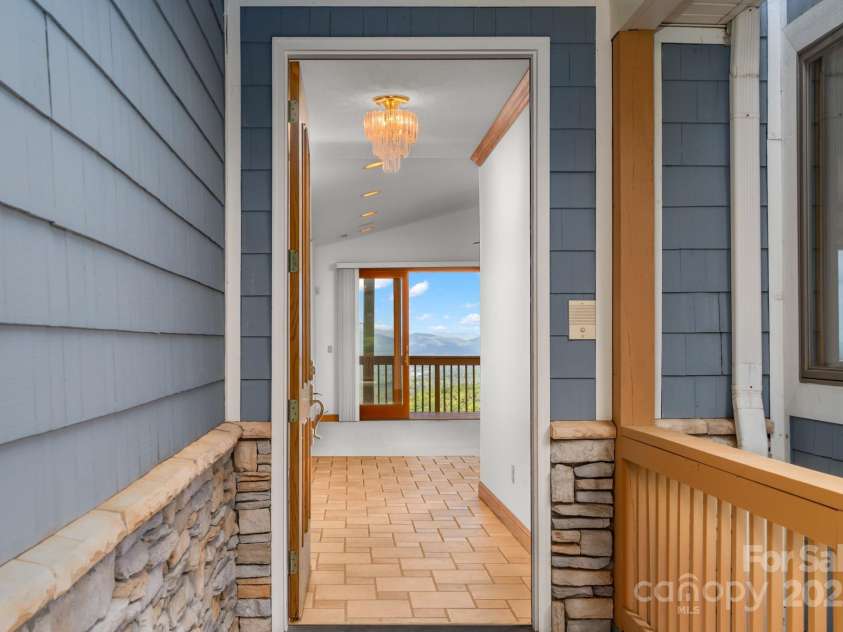 117 Distant View Drive, Asheville, NC 28803.  MLS# CAR4253814, YatesRealty ID 3225. Immediately be drawn to the expansive western views from the moment you enter the home.