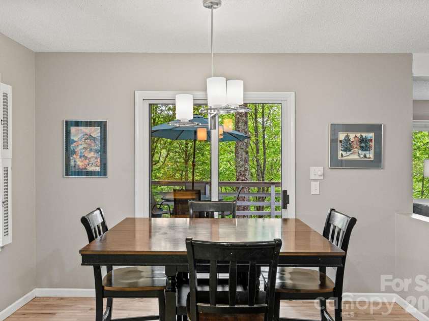 58 Sourwood Drive, Mills River, NC 28759.  MLS# CAR4390836, YatesRealty ID 32251. Dining area opens to rear deck