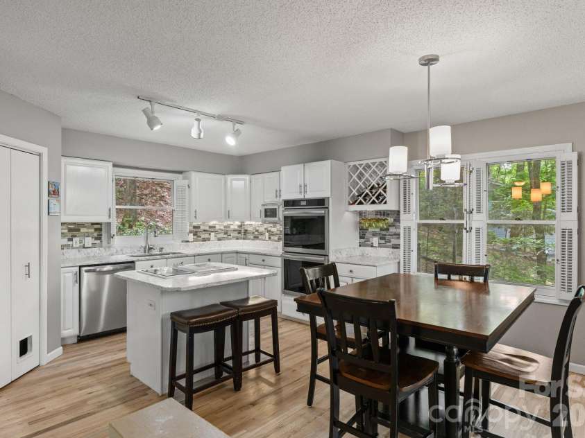 58 Sourwood Drive, Mills River, NC 28759.  MLS# CAR4390836, YatesRealty ID 32251. Kitchen and dining area