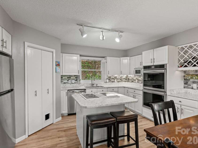 58 Sourwood Drive, Mills River, NC 28759.  MLS# CAR4390836, YatesRealty ID 32251. Kitchen and dining area