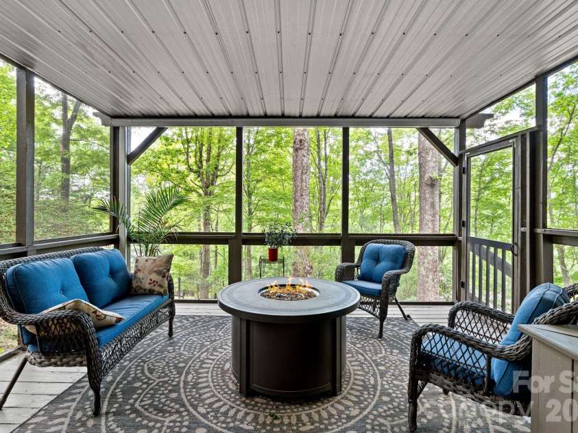 58 Sourwood Drive, Mills River, NC 28759.  MLS# CAR4390836, YatesRealty ID 32251. Lower level screened porch