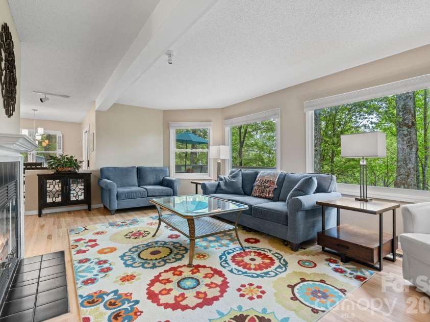 58 Sourwood Drive, Mills River, NC 28759.  MLS# CAR4390836, YatesRealty ID 32251. Sunny living room with huge windows