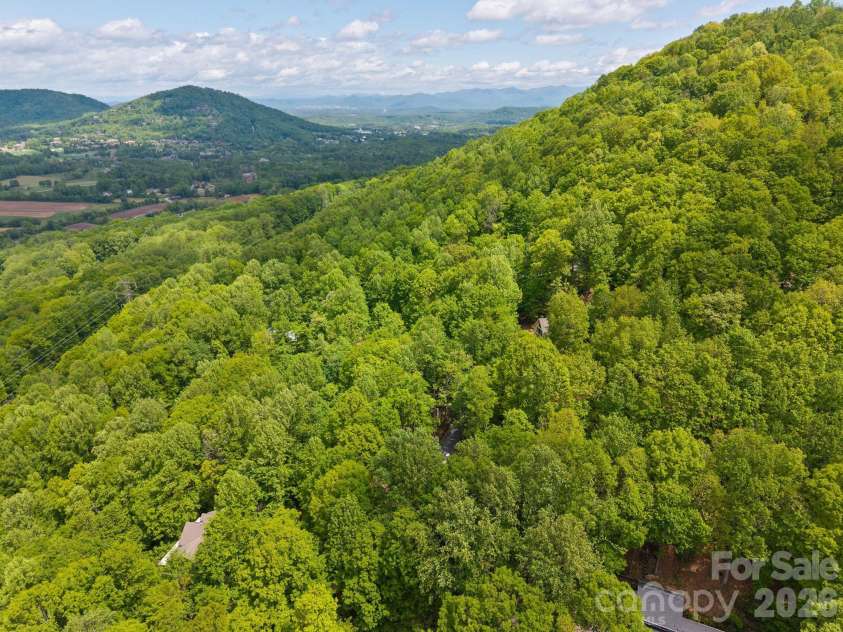 58 Sourwood Drive, Mills River, NC 28759.  MLS# CAR4390836, YatesRealty ID 32251. Surrounding home