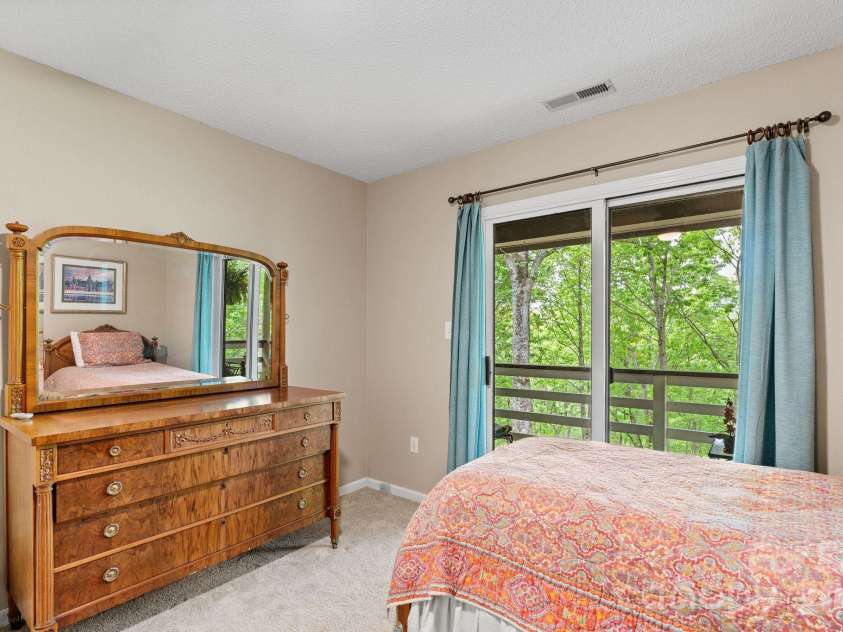 58 Sourwood Drive, Mills River, NC 28759.  MLS# CAR4390836, YatesRealty ID 32251. Upper level bedroom