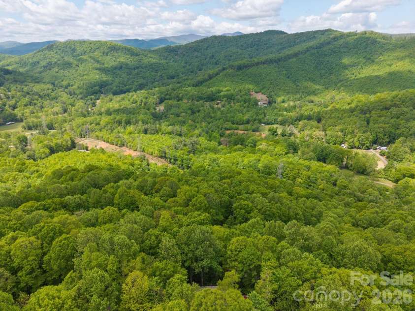 58 Sourwood Drive, Mills River, NC 28759.  MLS# CAR4390836, YatesRealty ID 32251. View behind home