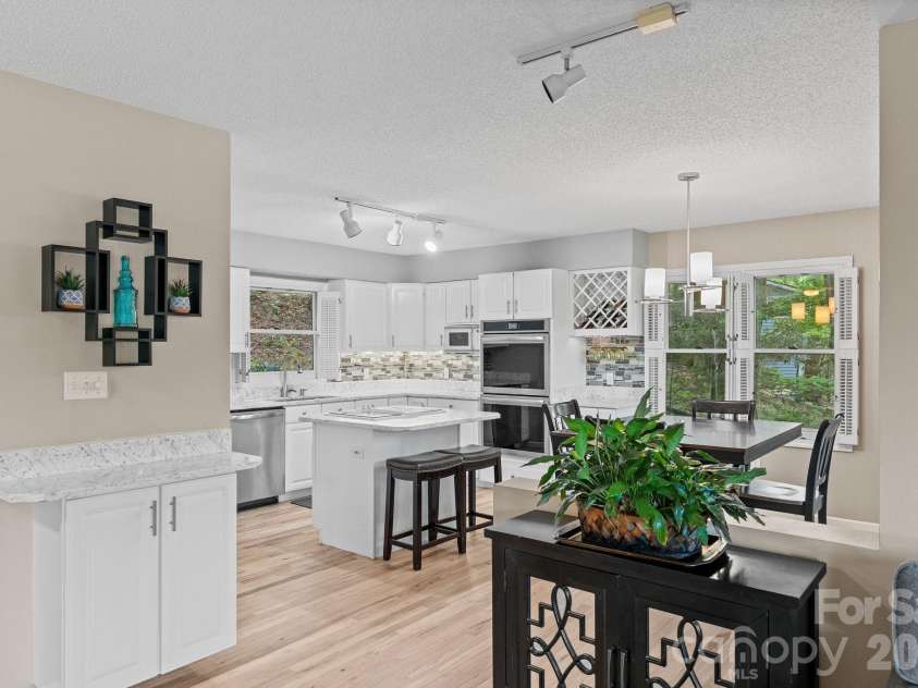 58 Sourwood Drive, Mills River, NC 28759.  MLS# CAR4390836, YatesRealty ID 32251. View into kitchen from living room