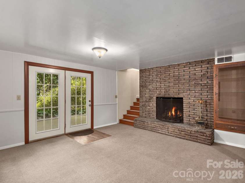 18 Wild Violet Lane, Arden, NC 28704.  MLS# CAR4284838, YatesRealty ID 32256. Lower level family room