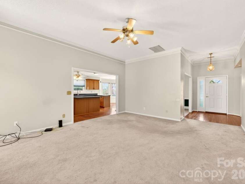 7716 Conifer Circle, Indian Trail, NC 28079.  MLS# CAR4389738, YatesRealty ID 32257. The FR opens also  to the large kitchen so there is easy communication if needed from both rooms.