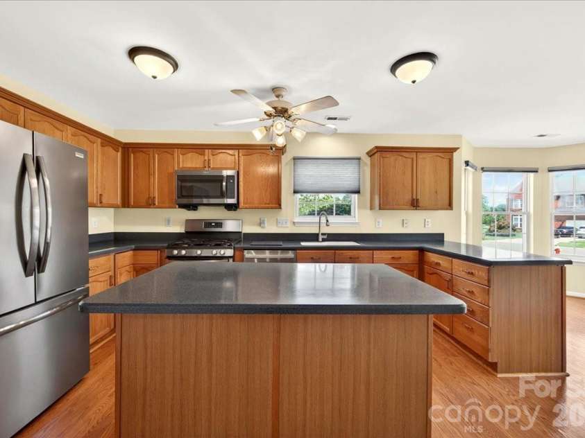 7716 Conifer Circle, Indian Trail, NC 28079.  MLS# CAR4389738, YatesRealty ID 32257. The island has counter top seating if needed or preferred.