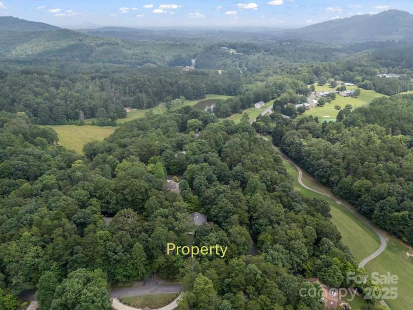 134 Downing Place, Lake Lure, NC 28746.  MLS# CAR4289968, YatesRealty ID 32258. Aerial View - prop. is across street from golf course