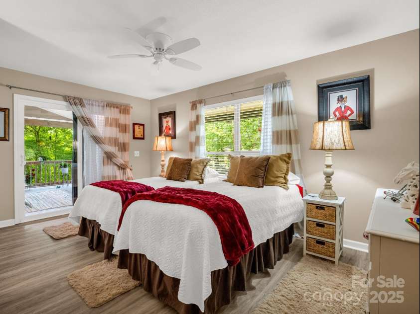134 Downing Place, Lake Lure, NC 28746.  MLS# CAR4289968, YatesRealty ID 32258. Bedroom 3 - sliders to screened porch