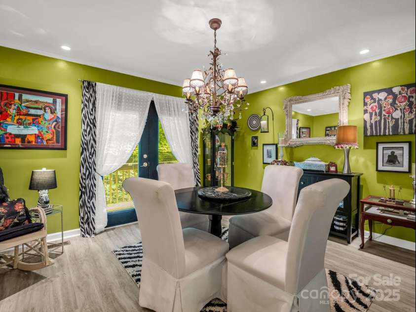 134 Downing Place, Lake Lure, NC 28746.  MLS# CAR4289968, YatesRealty ID 32258. Dining area leads to back deck