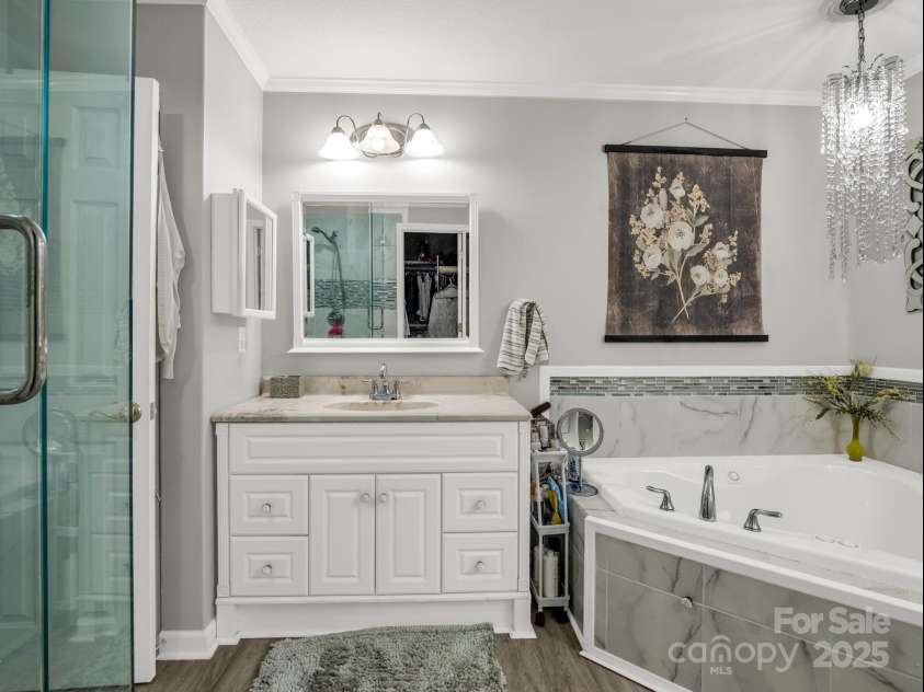 134 Downing Place, Lake Lure, NC 28746.  MLS# CAR4289968, YatesRealty ID 32258. One of two vanities, sep. tub & shower