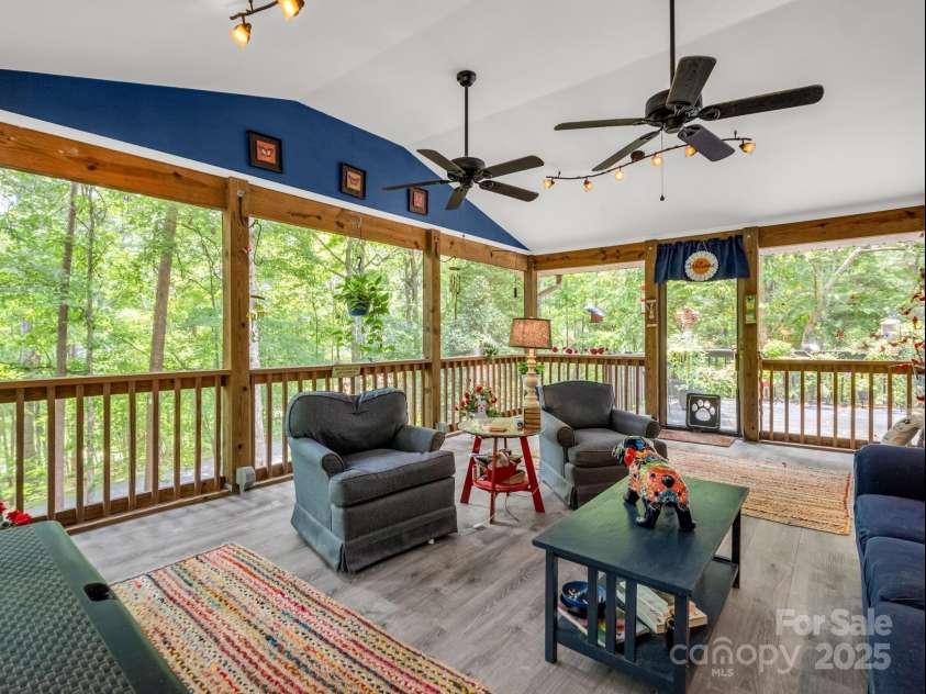 134 Downing Place, Lake Lure, NC 28746.  MLS# CAR4289968, YatesRealty ID 32258. Screened porch leads to front deck