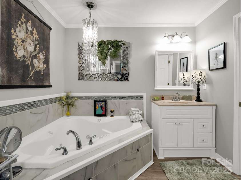 134 Downing Place, Lake Lure, NC 28746.  MLS# CAR4289968, YatesRealty ID 32258. Second separate vanity & jetted tub