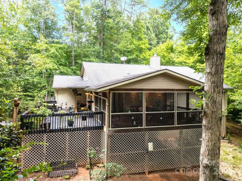 134 Downing Place, Lake Lure, NC 28746.  MLS# CAR4289968, YatesRealty ID 32258. South side of home