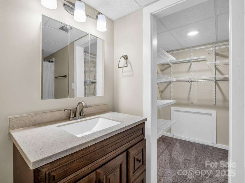 612 Buckeye Cove Road, Swannanoa, NC 28778.  MLS# CAR4287108, YatesRealty ID 32265. Basement level full bathroom and extra closet.