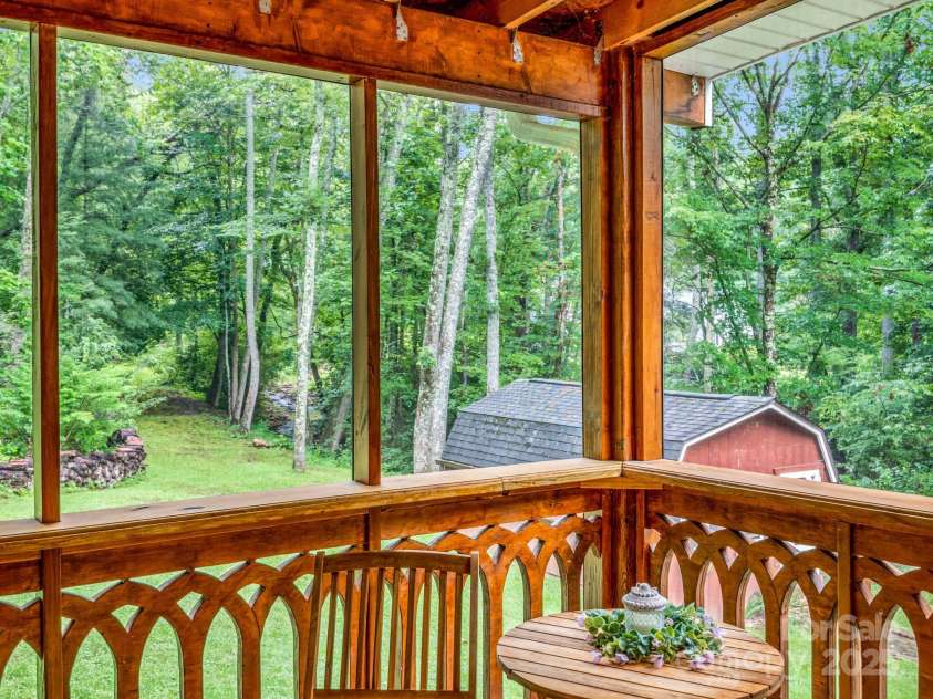 612 Buckeye Cove Road, Swannanoa, NC 28778.  MLS# CAR4287108, YatesRealty ID 32265. Beautiful woodwork enhances the back screened porch.