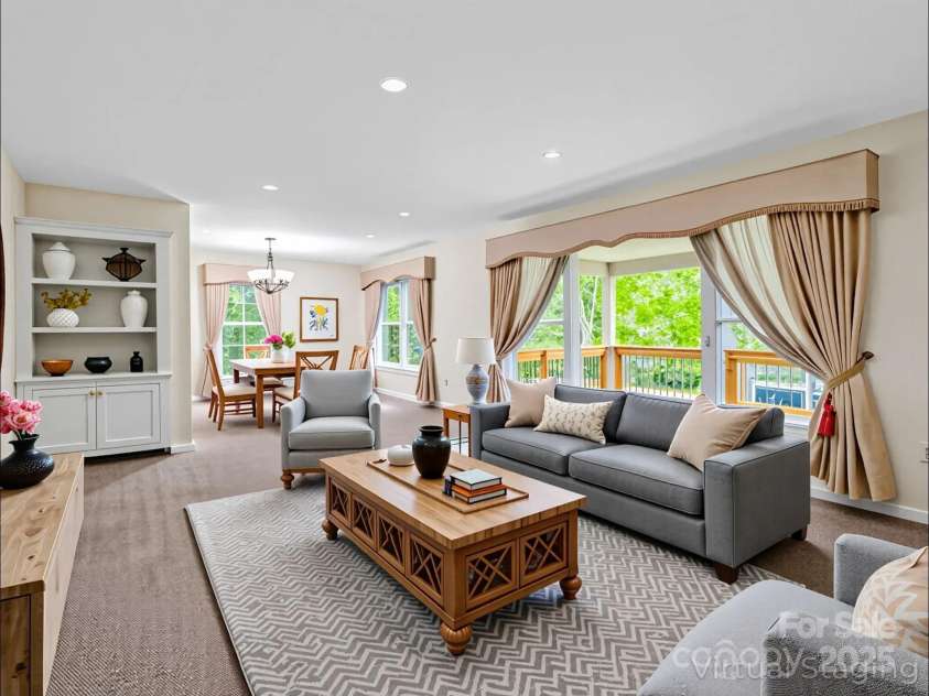 612 Buckeye Cove Road, Swannanoa, NC 28778.  MLS# CAR4287108, YatesRealty ID 32265. (VIRTUALLY STAGED) Living room and dining area.