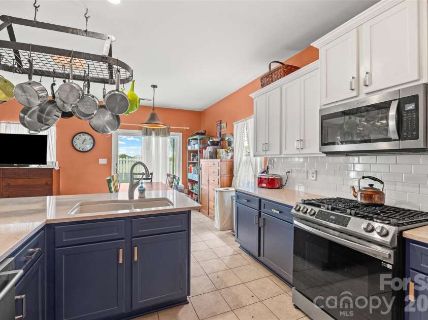 3310 Burnage Hall Road, Harrisburg, NC 28075.  MLS# CAR4387122, YatesRealty ID 32269. Kitchen looking into Breakfast Area