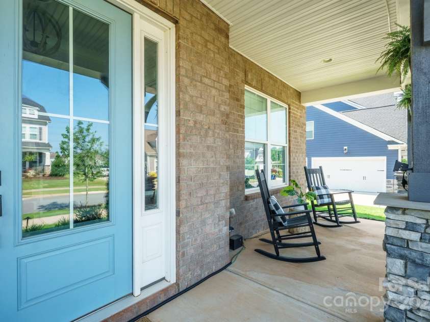 19012 Beecher Commons Drive, Huntersville, NC 28078.  MLS# CAR4276383, YatesRealty ID 32273. Covered, relaxing front porch with plenty of room for seating!