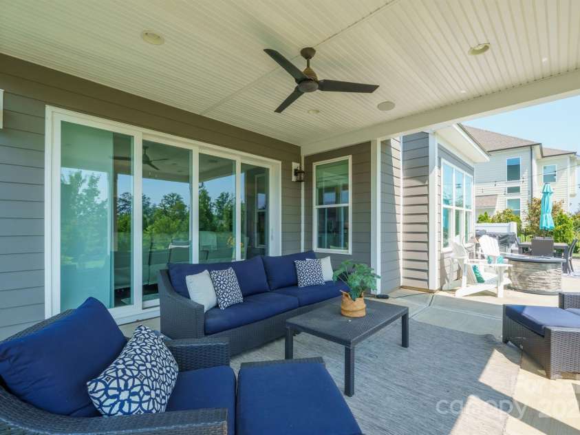 19012 Beecher Commons Drive, Huntersville, NC 28078.  MLS# CAR4276383, YatesRealty ID 32273. Expansive, covered patio is perfect for unwinding!