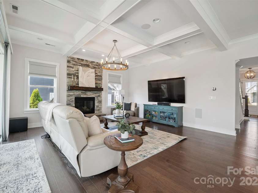 19012 Beecher Commons Drive, Huntersville, NC 28078.  MLS# CAR4276383, YatesRealty ID 32273. Great Room features stone, floor to ceiling, gas fireplace, coffered ceiling, custom light fixture, recessed lights & large window for great natural light!