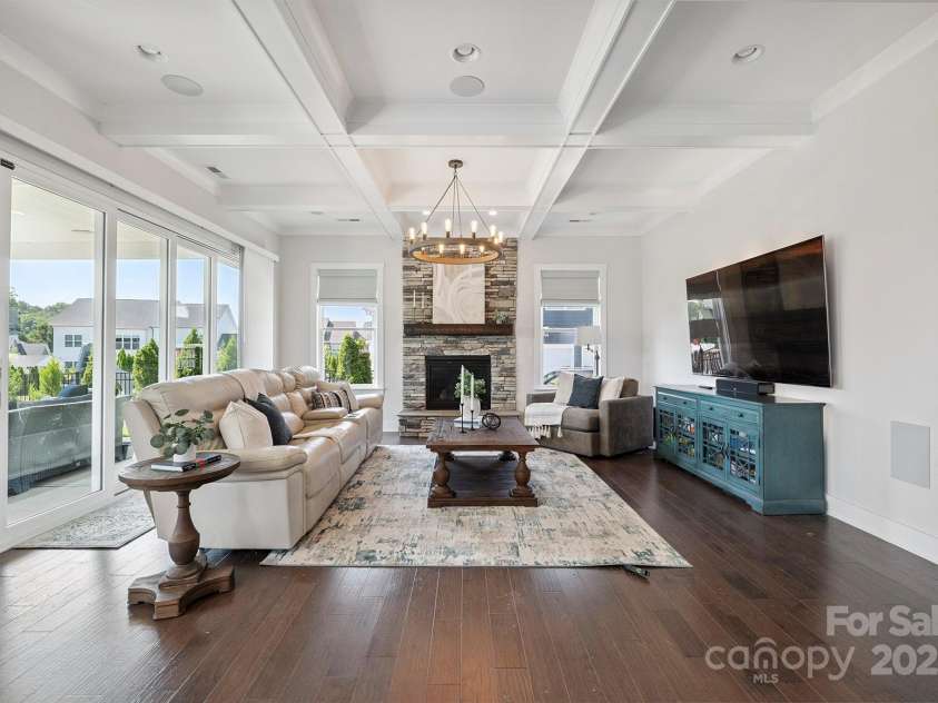 19012 Beecher Commons Drive, Huntersville, NC 28078.  MLS# CAR4276383, YatesRealty ID 32273. Great Room features stone, floor to ceiling, gas fireplace, coffered ceiling, custom light fixture, recessed lights & large window for great natural light!