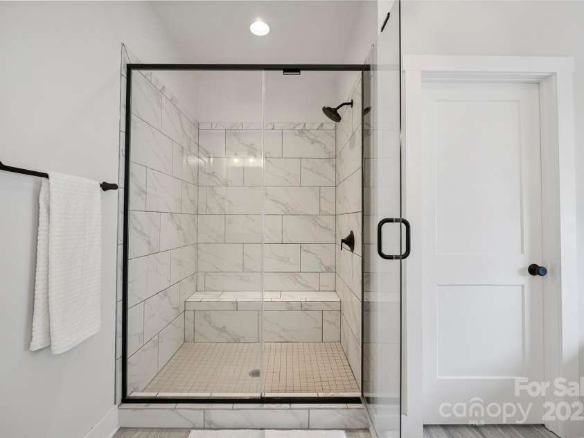 19012 Beecher Commons Drive, Huntersville, NC 28078.  MLS# CAR4276383, YatesRealty ID 32273. Primary Shower with bench seat!