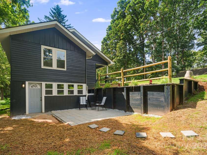 95 Grassy View Road, Candler, NC 28715.  MLS# CAR4283278, YatesRealty ID 32276. Enjoy quiet time on the porch! Level up with a fire pit or a hot tub!