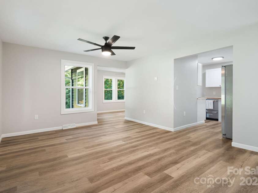 95 Grassy View Road, Candler, NC 28715.  MLS# CAR4283278, YatesRealty ID 32276. Light filled living room!