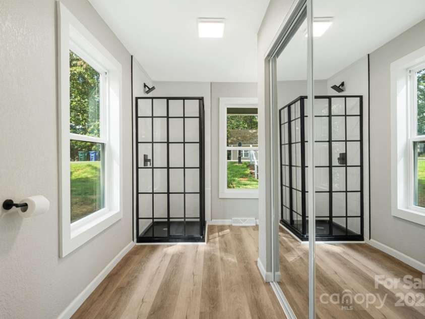 95 Grassy View Road, Candler, NC 28715.  MLS# CAR4283278, YatesRealty ID 32276. Shower and closet in primary bathroom