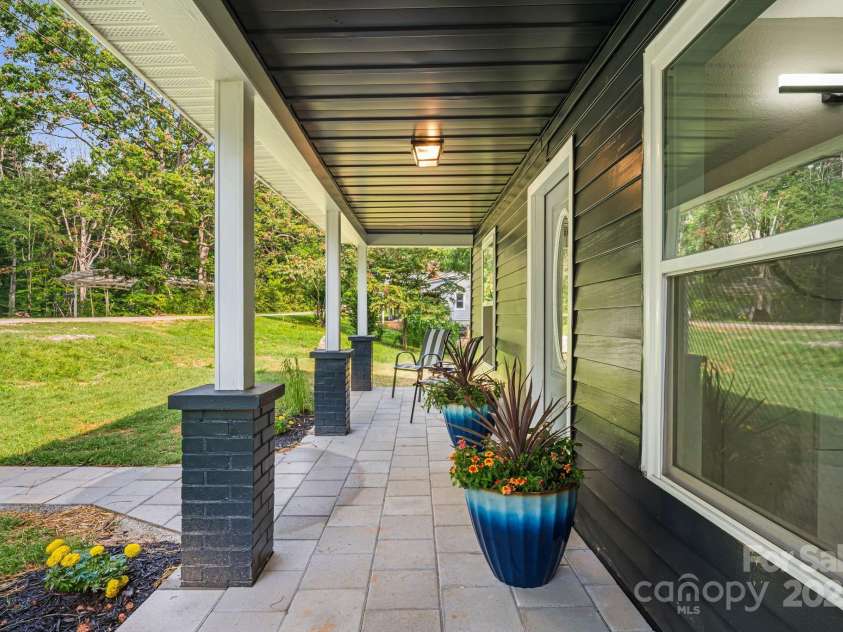 95 Grassy View Road, Candler, NC 28715.  MLS# CAR4283278, YatesRealty ID 32276. Sit a spell on the relaxing front porch!