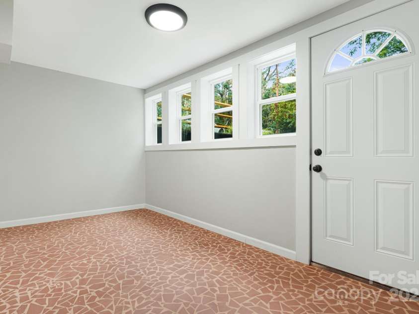 95 Grassy View Road, Candler, NC 28715.  MLS# CAR4283278, YatesRealty ID 32276. Sun filled spot can be your office or new favorite hangout space!