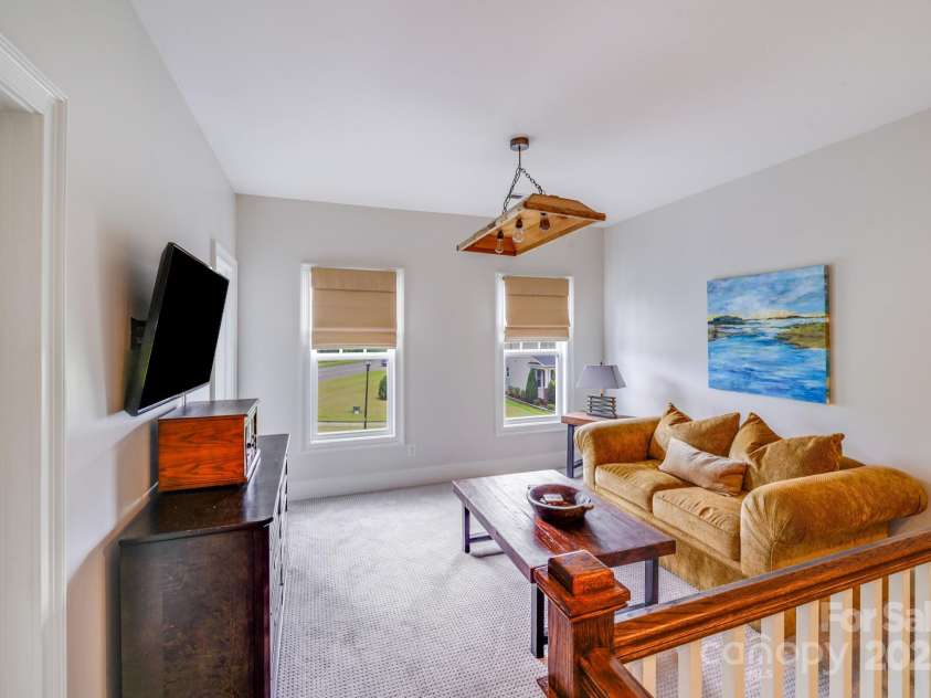 2702 Arsdale Road, Waxhaw, NC 28173.  MLS# CAR4287994, YatesRealty ID 32277. This versatile second-floor loft offers a cozy and functional flex space perfect for a variety of uses