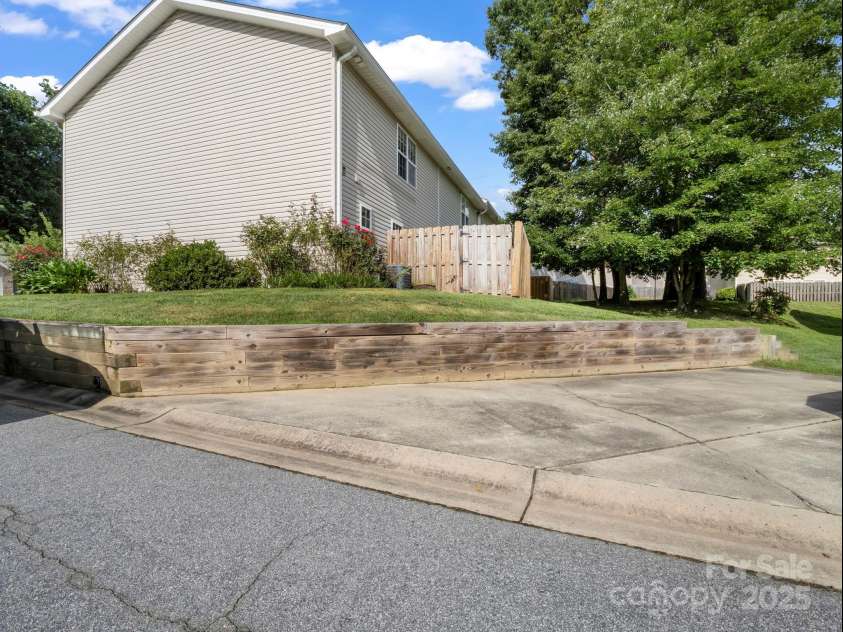 69 Wiltshire Circle, Fletcher, NC 28732.  MLS# CAR4290881, YatesRealty ID 32281. Check out the parking pad for 2 cars behind the unit - available for open use & ultra convenient to this home.