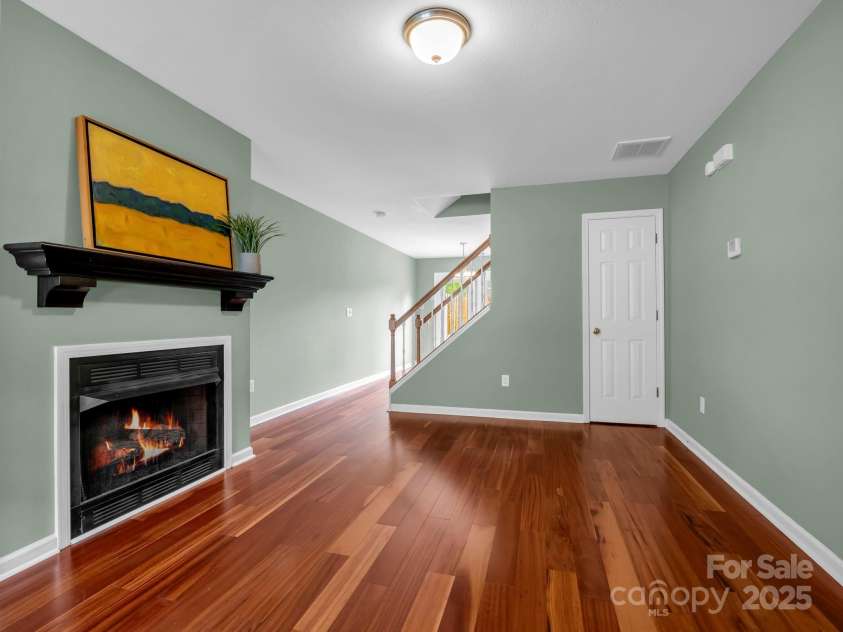 69 Wiltshire Circle, Fletcher, NC 28732.  MLS# CAR4290881, YatesRealty ID 32281. The living room features a gas log fireplace - flip on the switch and cozy up!