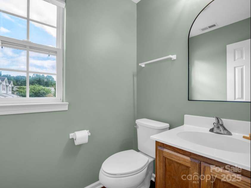 69 Wiltshire Circle, Fletcher, NC 28732.  MLS# CAR4290881, YatesRealty ID 32281. The main level offers a guest bath / powder room.