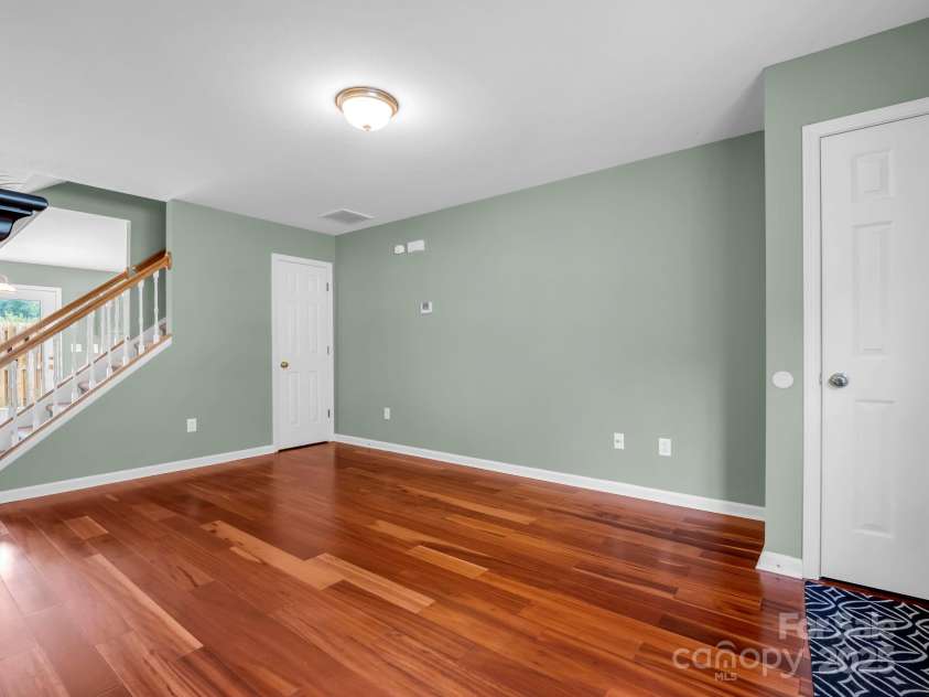 69 Wiltshire Circle, Fletcher, NC 28732.  MLS# CAR4290881, YatesRealty ID 32281. The paint is fresh and the floor is upgraded - you'll enjoy the beauty and ease of this prefinished wood flooring.