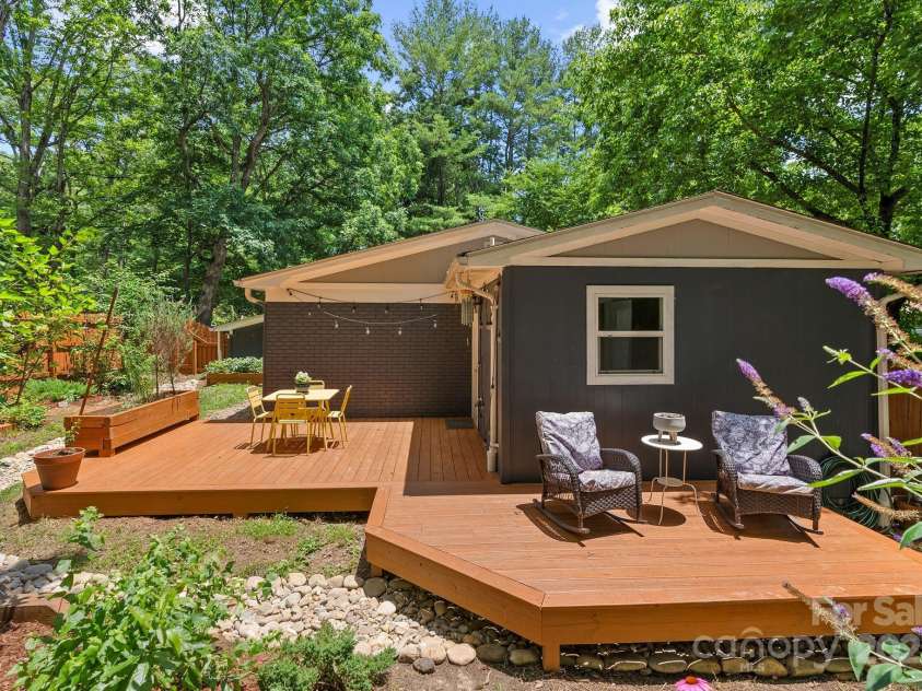 207 Oconeechee Avenue, Black Mountain, NC 28711.  MLS# CAR4290585, YatesRealty ID 32284. Large Wrap Around Deck Overlooks Yard