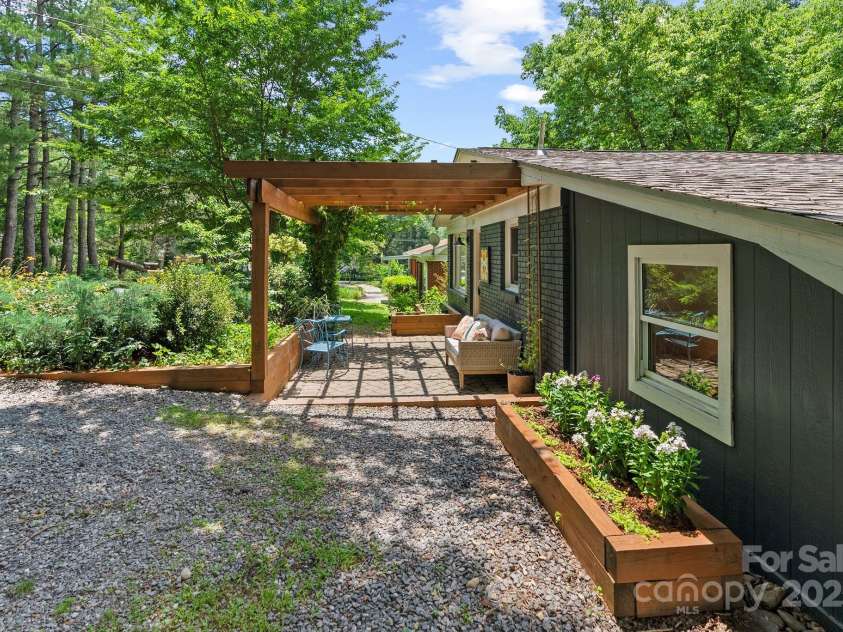 207 Oconeechee Avenue, Black Mountain, NC 28711.  MLS# CAR4290585, YatesRealty ID 32284. Raised Beds * Arbor Covered Patio