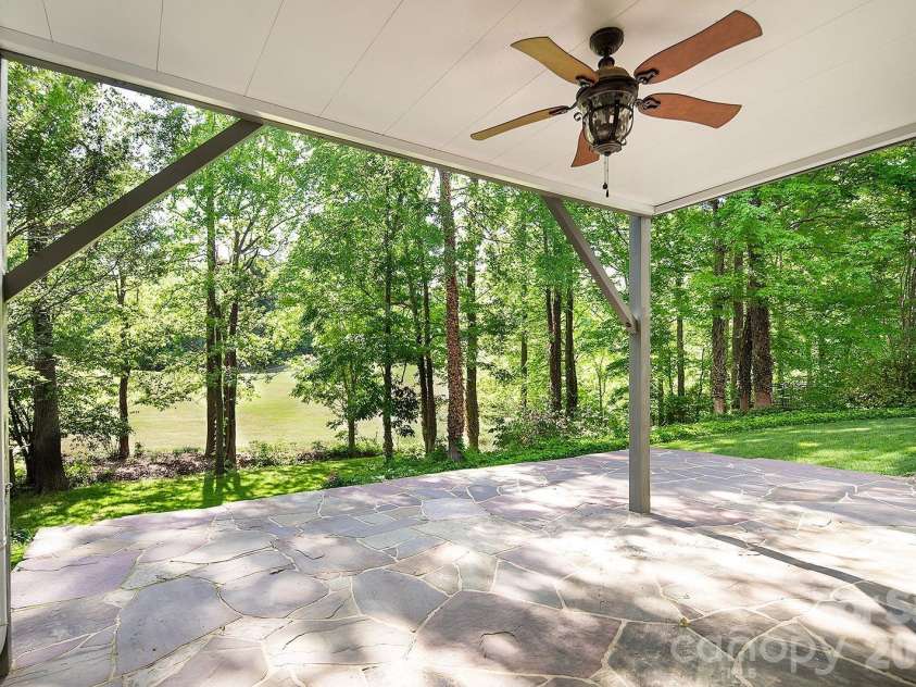 619 Oak Drive, Huntersville, NC 28078.  MLS# CAR4371399, YatesRealty ID 32284. Lower Level Covered Patio on Golf Course