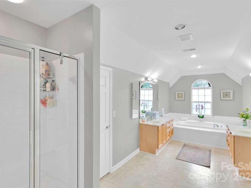 10837 Wilklee Drive, Charlotte, NC 28277.  MLS# CAR4291403, YatesRealty ID 32289. Extended shower - dual sinks and dual walk in closets. Sunken tub for when you want to have your own spa day