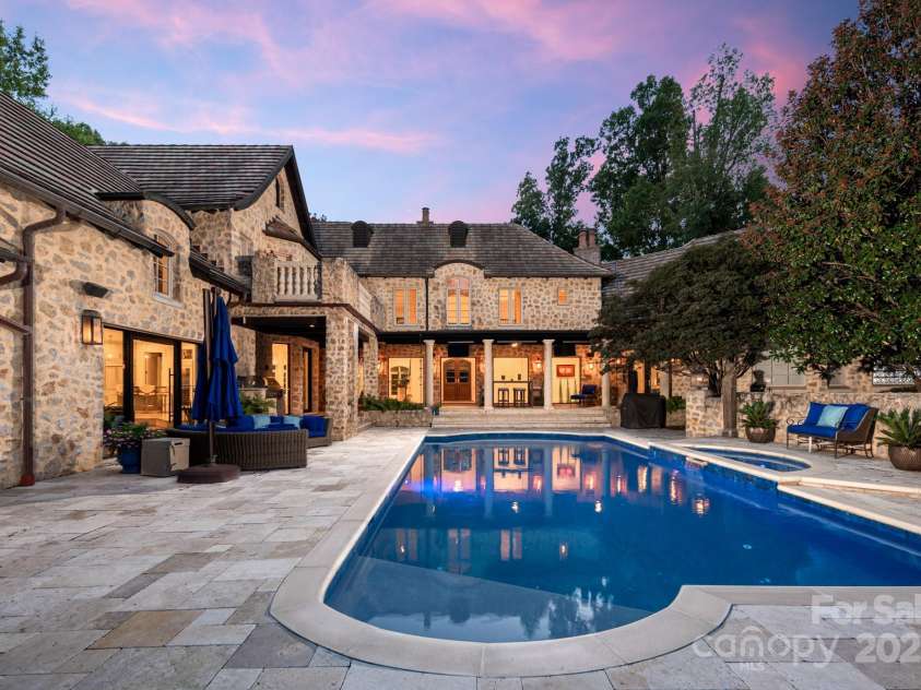 4231 Fox Brook Lane, Charlotte, NC 28211.  MLS# CAR4186375, YatesRealty ID 3229. As dusk descends it's time to enjoy the built in grill, fire pit and then a dip in the hot tub.