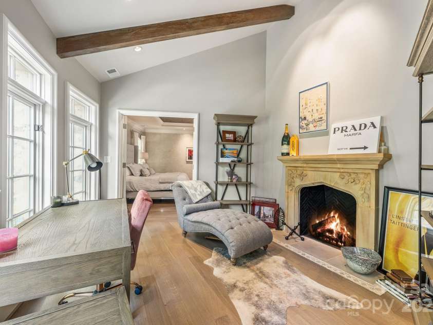 4231 Fox Brook Lane, Charlotte, NC 28211.  MLS# CAR4186375, YatesRealty ID 3229. The beamed ceiling frames this cozy sitting room or second office space with a limestone carved mantle.