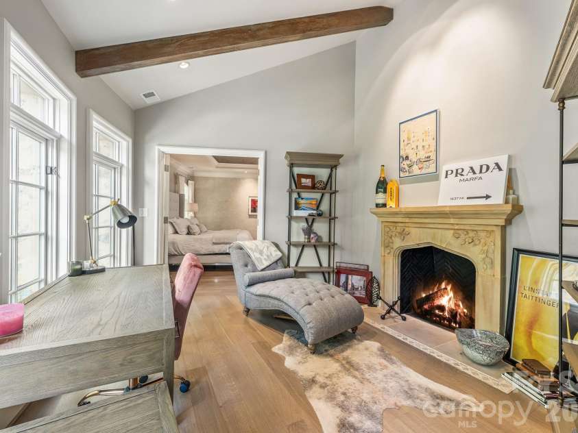 4231 Fox Brook Lane, Charlotte, NC 28211.  MLS# CAR4335388, YatesRealty ID 3229. The beamed ceiling frames this cozy sitting room or second office space with a limestone carved mantle.