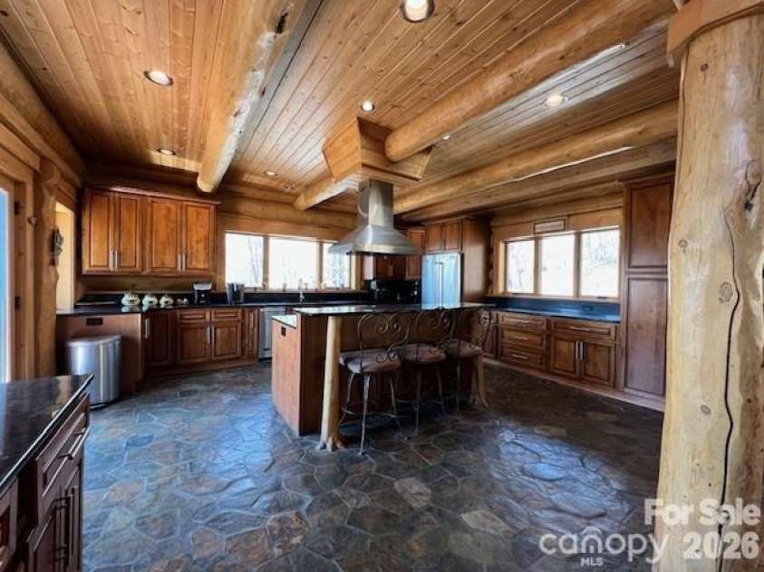 51 Airport Road, Mars Hill, NC 28754.  MLS# CAR4395052, YatesRealty ID 32292. MAIN - KITCHEN; FLAGSTONE FLOORING
