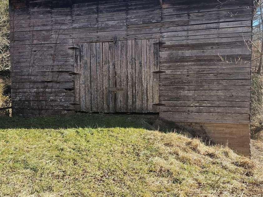 1820 Grapevine Road, Marshall, NC 28753.  MLS# CAR4219221, YatesRealty ID 3230. Barn as seen from the path to the house